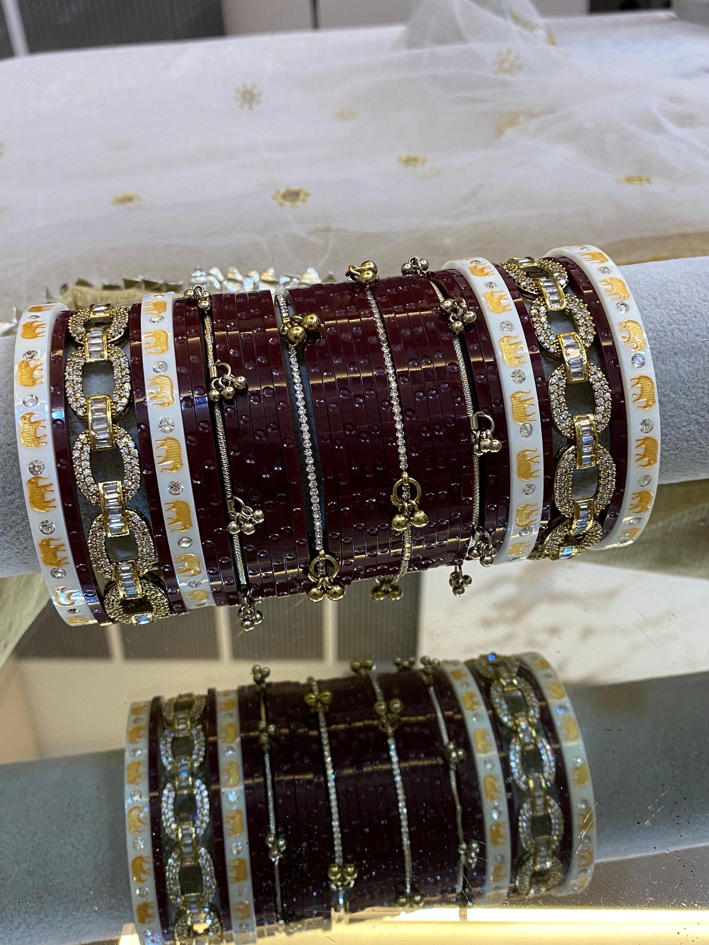 AN ANTIQUE CHURA WITH RAIN DROP CHURA BANGLES